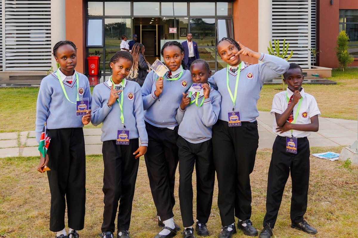 Six students posing outside with Lexicon championship badges